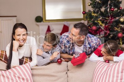 Peaceful family leaning on the couch