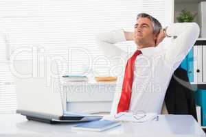 Relaxed businessman sitting and relaxing
