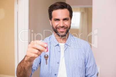 Casual man showing his house key