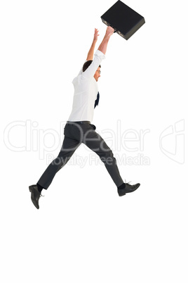 Businessman leaping with his briefcase