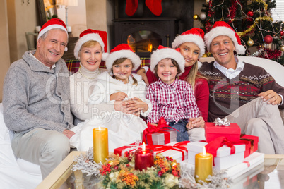 Happy extended family looking at camera at christmas time