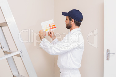 Painter holding a colour chart