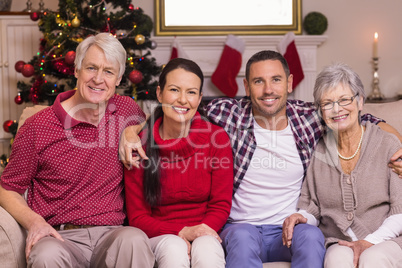 Portrait of a happy family sitting on sofa