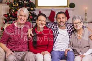 Portrait of a happy family sitting on sofa