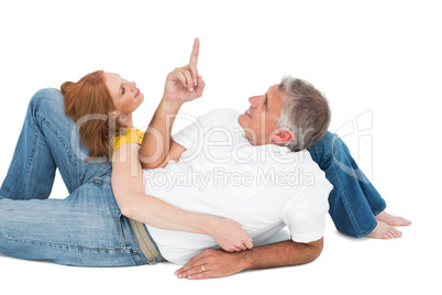 Casual couple lying on floor