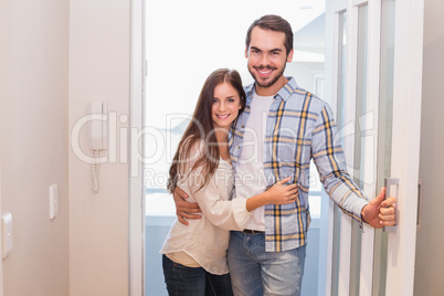 Cute couple walking through the door