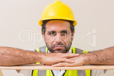 Stern construction worker looking at camera