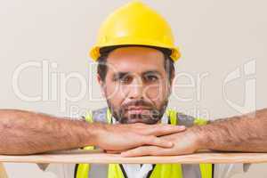 Stern construction worker looking at camera