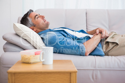 Relaxed man lying on the couch