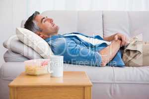 Relaxed man lying on the couch