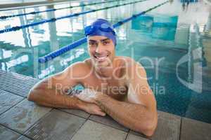 Portrait of swimmer in pool at leisure center