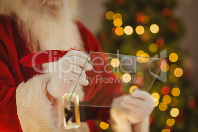 Santa claus writing list on the glass