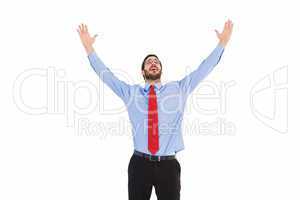 Happy cheering businessman raising his arms