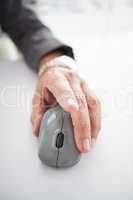 Businessmans hand on computer mouse
