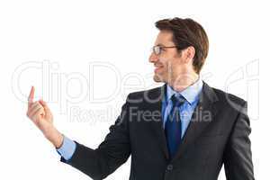 Smiling businessman pointing at a copy space