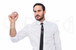 Focused businessman writing with marker