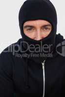 Portrait of a burglar with black jacket and balaclava