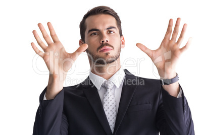 Serious businessman with finger spread out