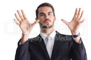 Serious businessman with finger spread out