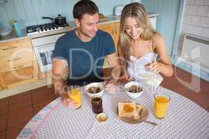 Cute couple having breakfast together