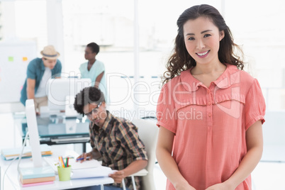 Young creative woman smiling at camera