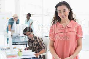 Young creative woman smiling at camera