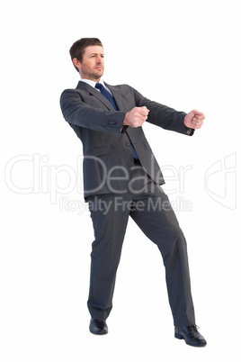 Handsome businessman pulling with hands