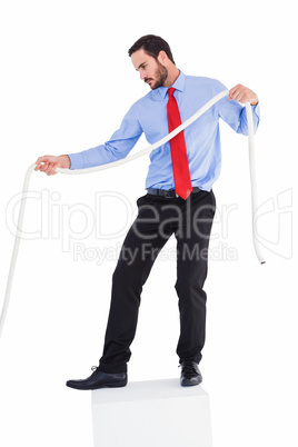 Focused businessman pulling a rope