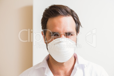 Carpenter wearing protective mask looking at camera