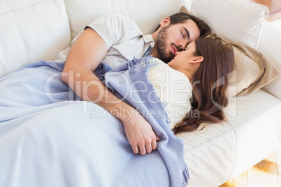 Cute couple napping on couch