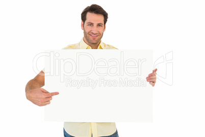 Handsome man smiling and pointing white poster