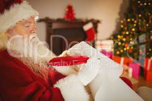 Santa claus writing his list on scroll