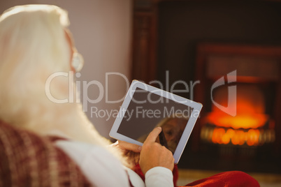 Father christmas touching tablet pc