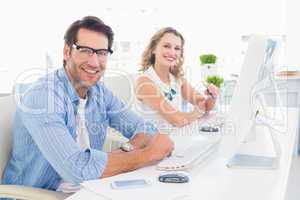 Attractive designers smiling at camera
