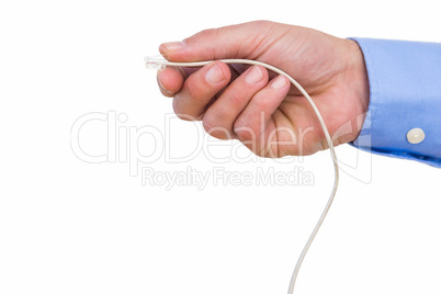 Hand of a businessman connecting a cable