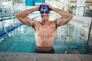 Fit swimmer in the pool at leisure center