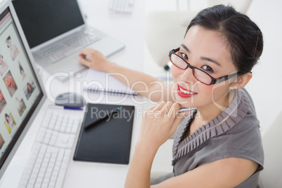 Photo editor working at her desk