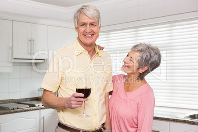 Senior couple drinking red wine