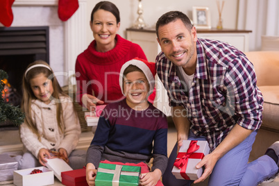 Portrait of smiling family celebrating christmas