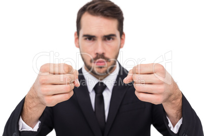 Exasperated businessman with clenched fists