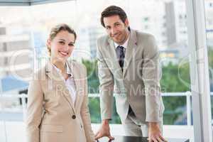 Business people posing and smiling at camera