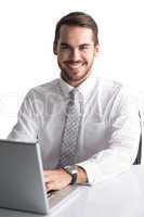 Happy businessman using his laptop