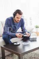 Young man listening to cds
