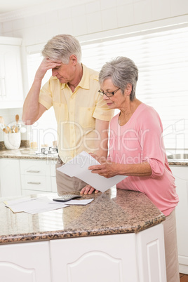 Senior couple paying their bills