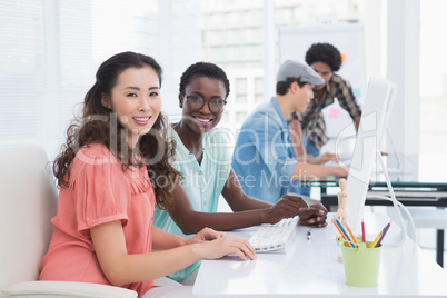 Young creative team working at desk