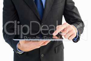 Close up of finger from businessman touching tablet