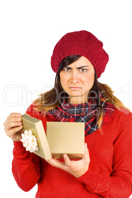 Unhappy brunette opening christmas gift