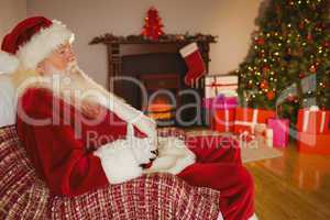 Santa claus sitting and holding his belly