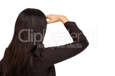 Pretty businesswoman looking with hand up