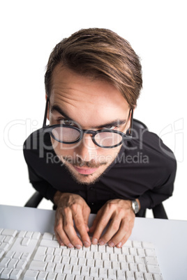 Portrait of a smiling businessman using computer